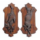 A pair of Continental, probably German or Swiss carved and stained wood wall...  A pair of