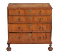 A walnut chest of drawers, first quarter 18th century and later  A walnut chest of drawers,