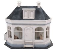 A Dutch carved and painted wood birdcage in the form of a house  A Dutch carved and painted wood