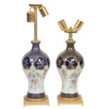 A pair of French porcelain and Italian gilt metal mounted table lamps  A pair of French porcelain