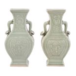 A pair of Chinese celadon two-handled vases, with moulded dragon panels  A pair of Chinese celadon