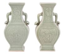 A pair of Chinese celadon two-handled vases, with moulded dragon panels  A pair of Chinese celadon