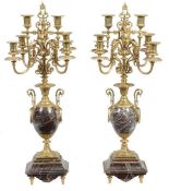 A pair of Continental gilt metal mounted marble six light candelabra, late 19th century, each with