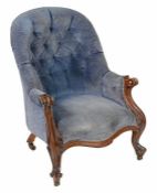 A Victorian walnut and button upholstered armchair, circa 1870 A Victorian walnut and button
