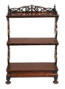 A William IV rosewood three tier what not, circa 1835, with a floral pierced three quarter gallery