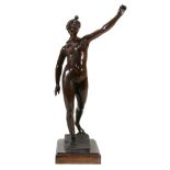 A Continental patinated bronze model of a female nude  A Continental patinated bronze model of a