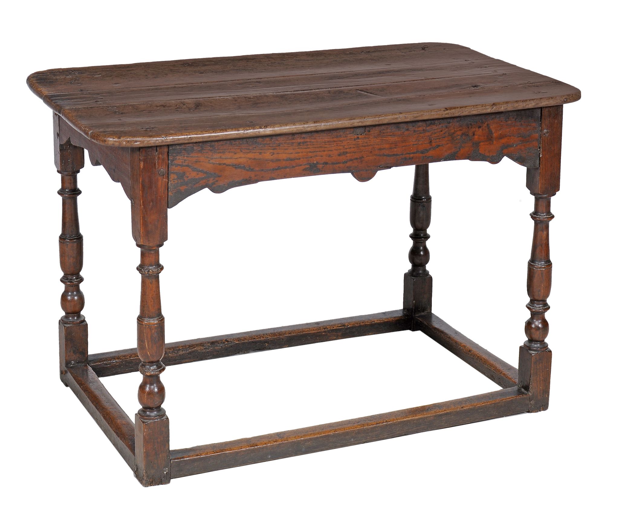 An oak centre table , late 17th century, the plank top with rounded corners...  An oak centre table