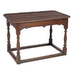 An oak centre table , late 17th century, the plank top with rounded corners...  An oak centre table