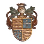 A Continental carved, painted and parcel gilt armorial wall panel  A Continental carved, painted and