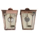 A pair of copper and glazed wall lanterns, second half 20th century A pair of copper and glazed wall
