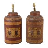 A pair of Regency red japanned and parcel gilt metal tea canisters  A pair of Regency red japanned