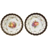 A pair of Royal Worcester plates signed by E  A pair of Royal Worcester plates signed by  E.