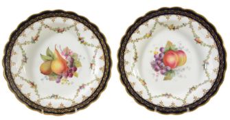 A pair of Royal Worcester plates signed by E  A pair of Royal Worcester plates signed by  E.
