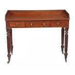 A William IV mahogany three drawer writing table, circa 1830  A William IV mahogany three drawer