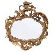 A carved giltwood wall mirror in George III style, 19th century  A carved giltwood wall mirror in