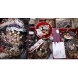 A mixed lot of costume jewellery, including: necklaces, bangles, butterfly wing brooches, strings of