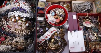 A mixed lot of costume jewellery, including: necklaces, bangles, butterfly wing brooches, strings of