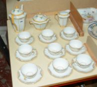 A Limoges porcelain part coffee service, Art Deco decoration, nine cups and saucers Best Bid