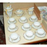 A Limoges porcelain part coffee service, Art Deco decoration, nine cups and saucers Best Bid