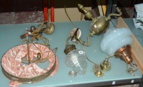 A brass three light electrolier, a copper mounted glass ceiling light, a brass and opaque glass