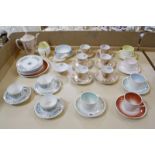 A Susie Cooper part teaset, five cups and saucers, six plates, sugar bowl and milk jug, a