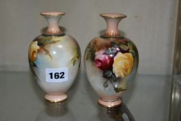 A pair of Royal Worcester Hadley's ware globular vases, painted with roses, puce printed marks, date