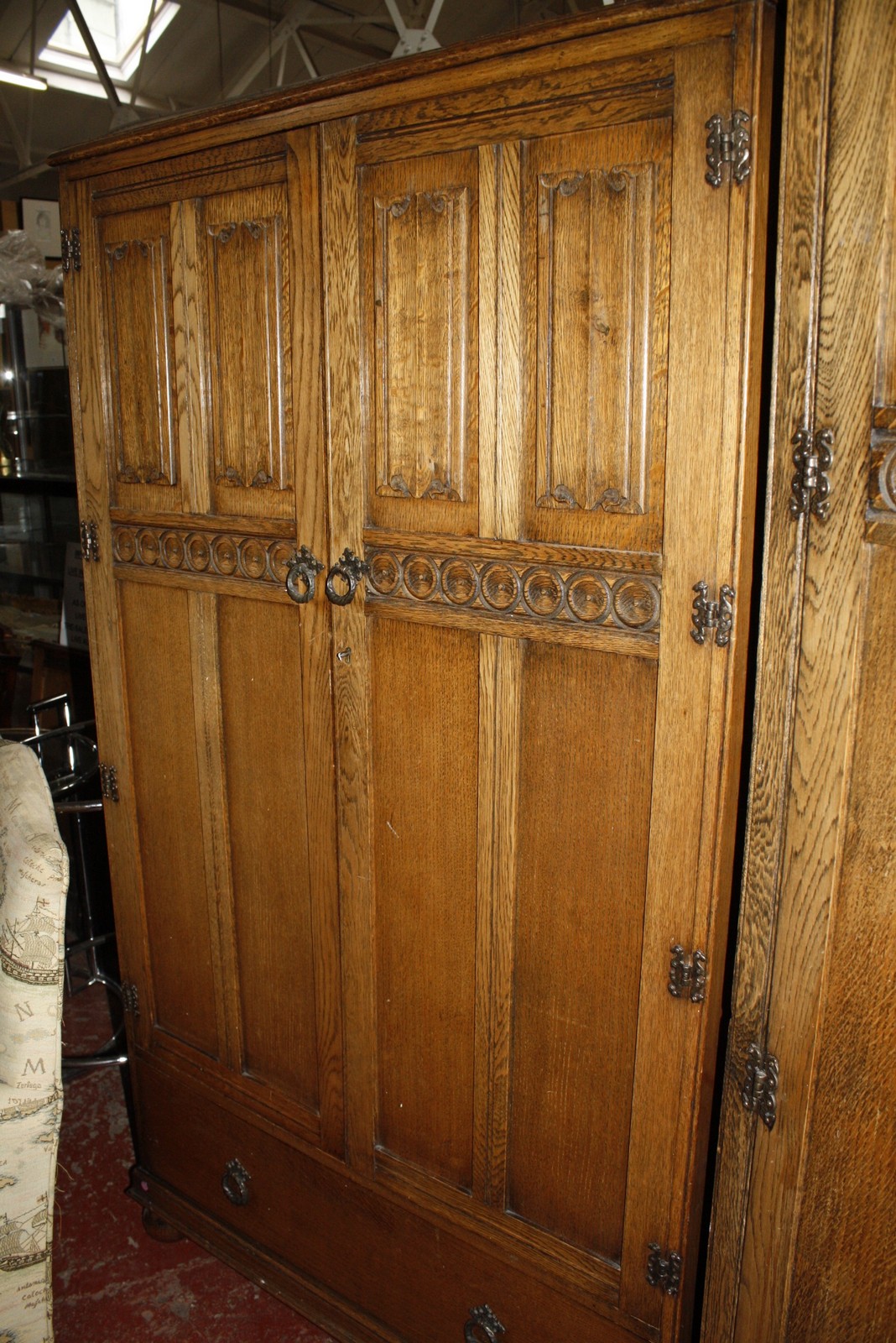 Two oak linen fold panelled wardrobes and a headboard. Best Bid - Image 2 of 2