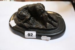 After Mene, a bronze model of a greyhound, lying down, on plinth base, 5.5cm high approx.