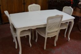 A painted table in Louis XV style, and four matching canework chairs
