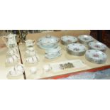 A modern French part dinner service, floral decorated and a French part tea service, with floral