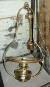 A brass oil hall hanging light, with opalescent shade