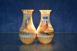 A pair of Royal Worcester pear shaped vases, painted with pheasants and signed by Jas. Stinton,