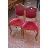 A set of six French walnut and upholstered armchairs