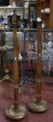 A pair of giltwood standard lamps and a pair of painted metal standard lamps with chain links (