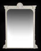 A Victorian carved gilt overmantel mirror, circa 1860, the crest with leaves and cartouche, turned