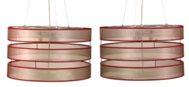 A pair of modern plated metal, fabric and glass cylindrical hanging ceiling lights, six light,