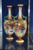 A pair Hadley's Worcester two-handled slender vases, painted with fruiting blackberries, circa