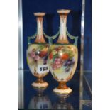 A pair Hadley's Worcester two-handled slender vases, painted with fruiting blackberries, circa