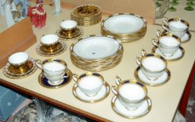 Nine Aynsley 'Empress Cobalt' teacups and seven saucers with gilt rim decoration, Aynsley '