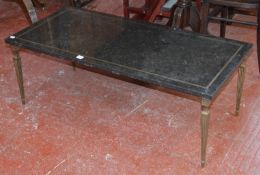 A brass and mottled black marble mounted coffee table 42cm high, 113cm wide