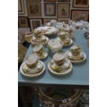 A Royal Worcester part tea service, painted with roses, one 9" lobed plate signed K. Blake and