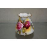 A pair of Royal Worcester purse vases, painted with roses, green printed marks, date code for