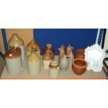 Four large stoneware flagons, six smaller stoneware flagons, stoneware vessels, pots and a modern