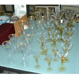 Nine 20th Century fluted crystal champagne glasses with gilt rim, four smaller flutes, champagne