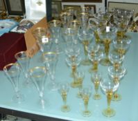 Nine 20th Century fluted crystal champagne glasses with gilt rim, four smaller flutes, champagne