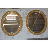 A pair of oval gilt frame mirrors 59cm high, 49cm wide