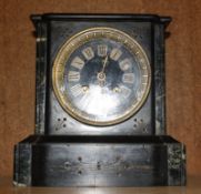 A 19th Century black slate mantel clock, 20cm high