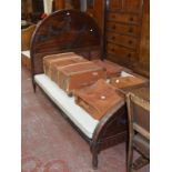 A carved mahogany single bed frame, the headboard with floral swags 138cm high, 206cm length,