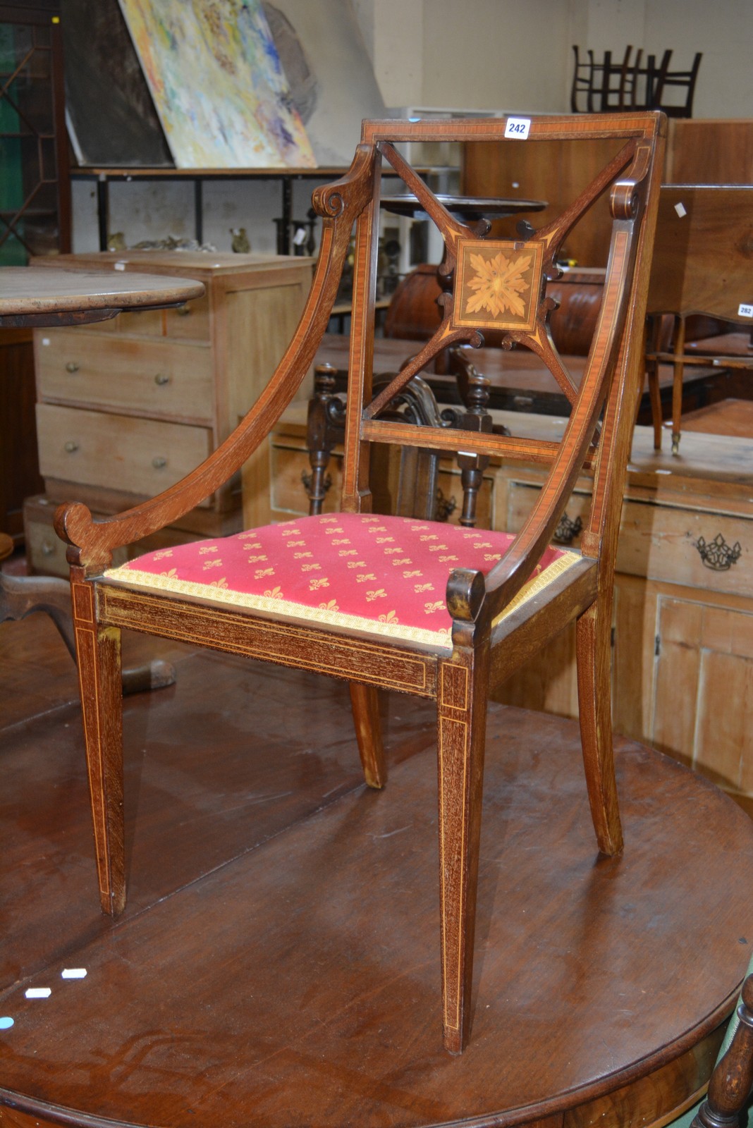 A Sheraton style Edwardian mahogany armchair