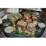 A collection of copper and brassware to include copper kettles, a copper lidded vessel, a pierced